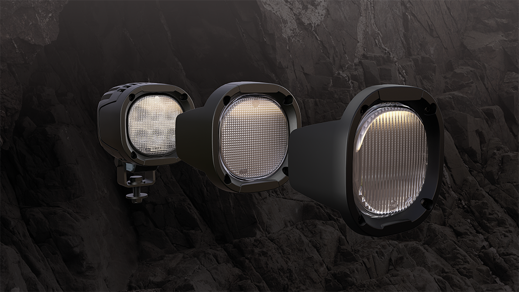 Image showing different lenses that is optional for TYRI work light 1010 XP-9 with mountain cliff in the background.