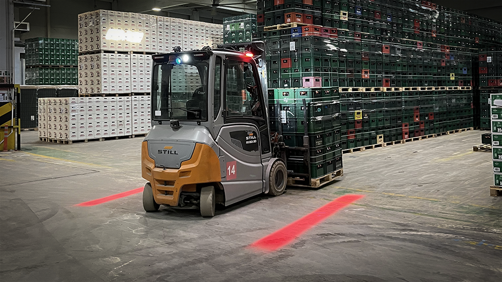 Still forklift operating in warehouse equipped with TYRI VL4 RedLine warning lights for enhanced safety and pedestrian awareness