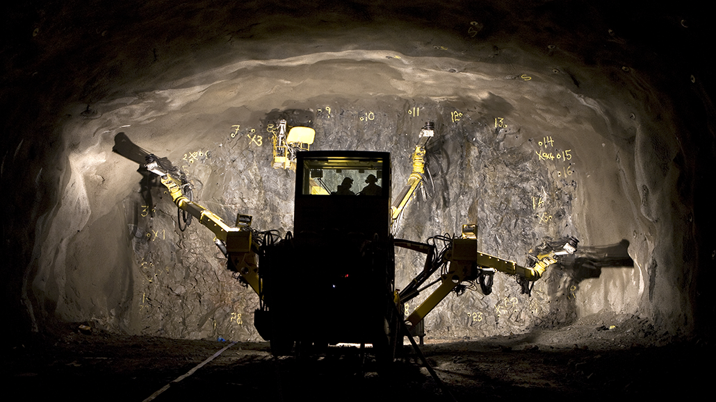 Epiroc Boomer XE3 at the face in underground mine, rear view. Equipped with TYRI work Lights 1313, 1323 and 1010 Curve