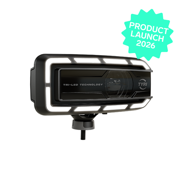 Product image of TYRI LED Driving Light DLM-F1 Tri-LED, facing right, with the Light turned off. Tech Green star with Product Launch 2026 in the upper right corner.
