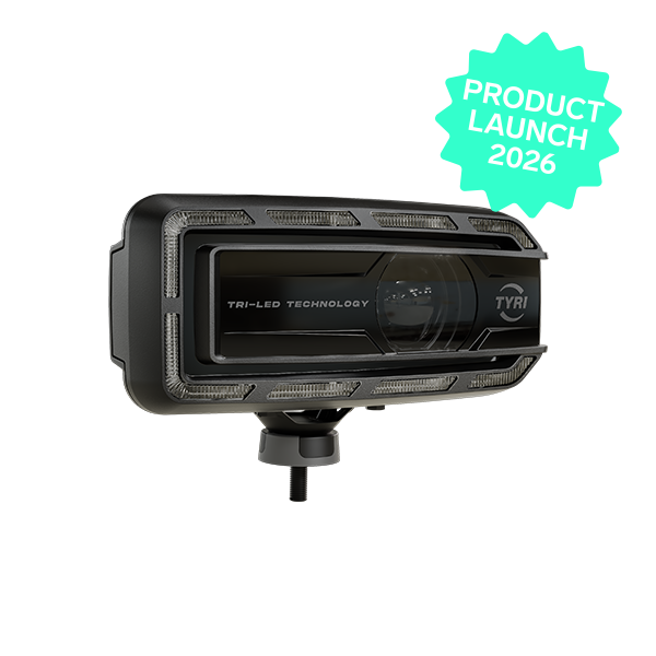Product image of TYRI LED Driving Light DLM-F1 Tri-LED, facing right, with the Light turned off. Tech Green star with Product Launch 2026 in the upper right corner.