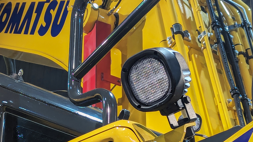 TYRI-1010-P5-Komatsu-Application-5-1030px TYRI 1010 P5 LED work light mounted on a Komatsu construction machine, showcasing durable design and powerful illumination for heavy equipment applications